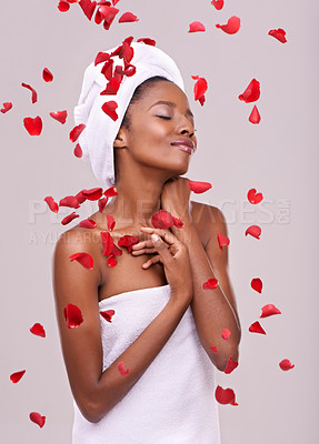Buy stock photo Happy, skincare and black woman with red petals, dermatology and treatment on a white studio background. Wellness, African person and model with natural beauty and grooming with luxury and aesthetic