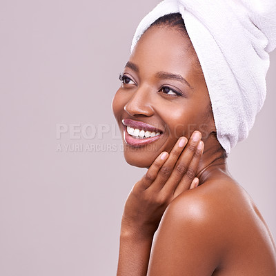 Buy stock photo Black woman, mockup and hair towel in studio with skincare, wellness or beauty on purple background. Makeup, cleaning or hands on face of happy female model touching soft, skin or cosmetic results