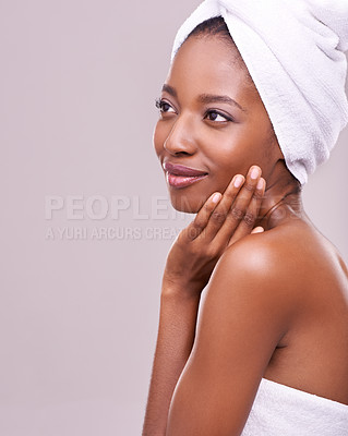 Buy stock photo Black woman, space and hair towel in studio with skincare, wellness or beauty on purple background. Makeup, cleaning or hands on face of calm female model touching soft, skin or cosmetic glow results