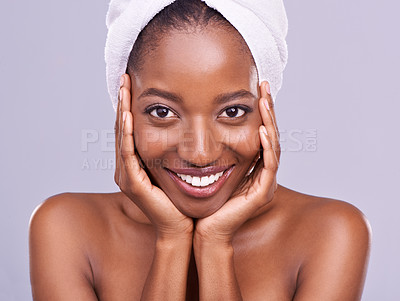 Buy stock photo Hair, towel and portrait of black woman in studio for skincare, wellness or body care on purple background. Beauty, cleaning and hands on face of African female model with cosmetic, shine or glow