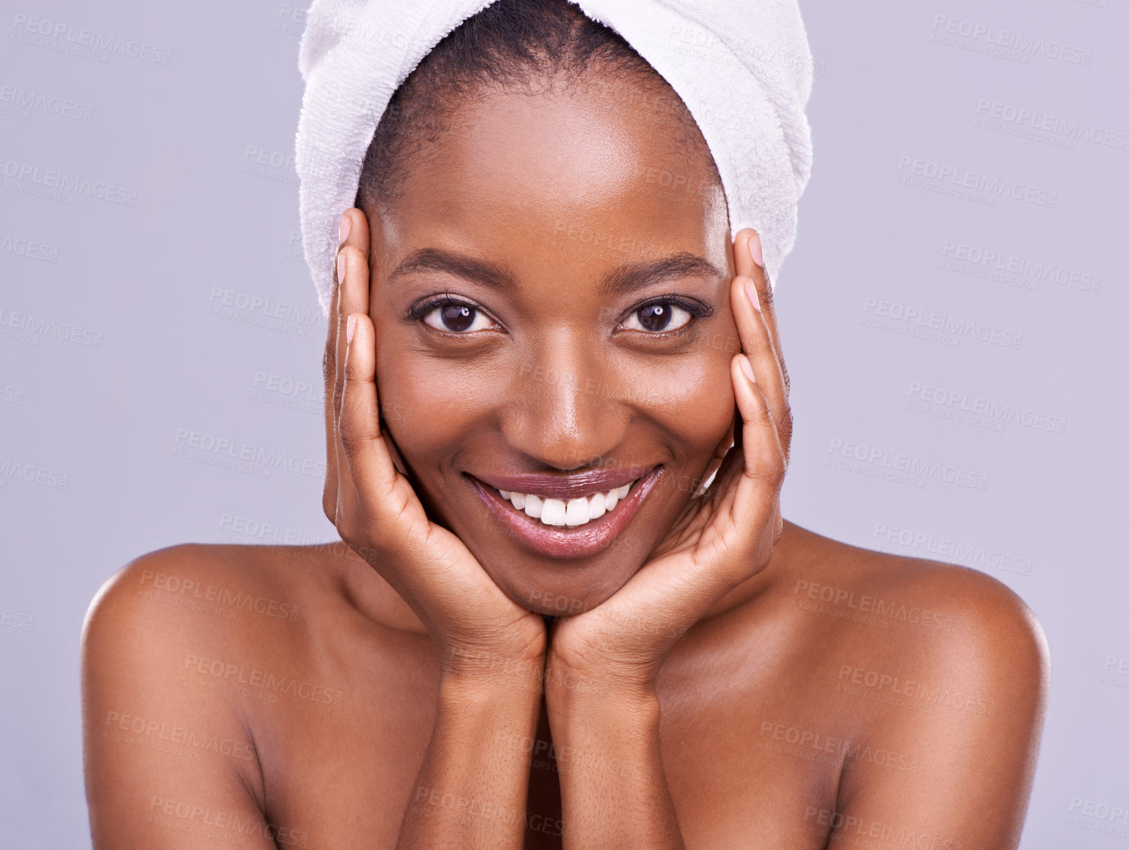 Buy stock photo Hair, towel and portrait of black woman in studio for skincare, wellness or body care on purple background. Beauty, cleaning and hands on face of African female model with cosmetic, shine or glow