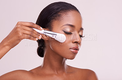 Buy stock photo Skincare, makeup and black woman with brush on face in studio mockup with cosmetic application tool. Beauty, blush and cosmetics, facial skin care model with luxury glow product on grey background.
