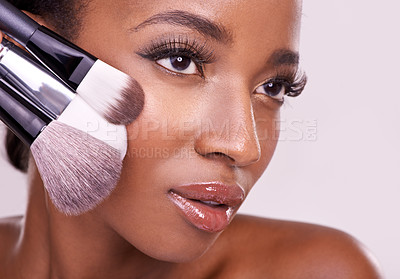 Buy stock photo Beauty product, makeup and black woman with brush on face in studio with cosmetic application tool. Skincare, blush and cosmetics, facial skin care model with luxury contour powder on pink background