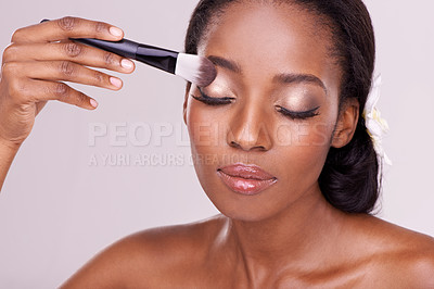 Buy stock photo Makeup,, beauty and face of black woman with brush in studio with cosmetics, wellness and eyeshadow. Salon aesthetic, dermatology or isolated person for cosmetology, spa or facial on white background