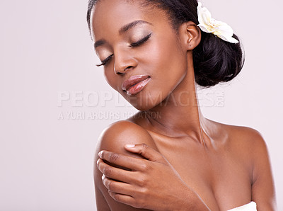 Buy stock photo Woman, face and orchid for cosmetics in studio with beauty, natural glow and self care with confidence. Model, african person or flower for cosmetology, facial treatment or makeup on white background