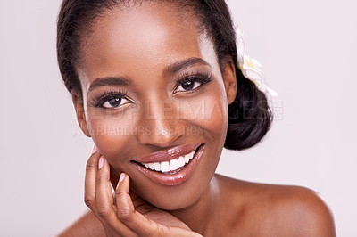 Buy stock photo Woman, portrait and skincare for beauty in studio with cosmetics, natural glow and self care with smile. Model, african person or face for cosmetology, facial treatment and makeup on white background