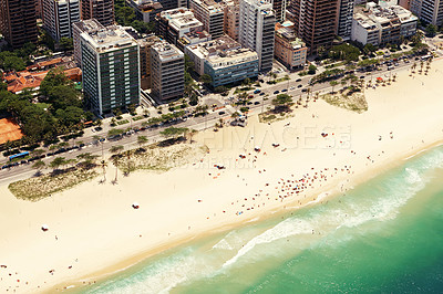 Buy stock photo Drone, beach and cityscape or sand with landscape for travel location, holiday and vacation in rio de janeiro. Aerial view, skyscraper and tourist on ocean in summer with street, water and waves