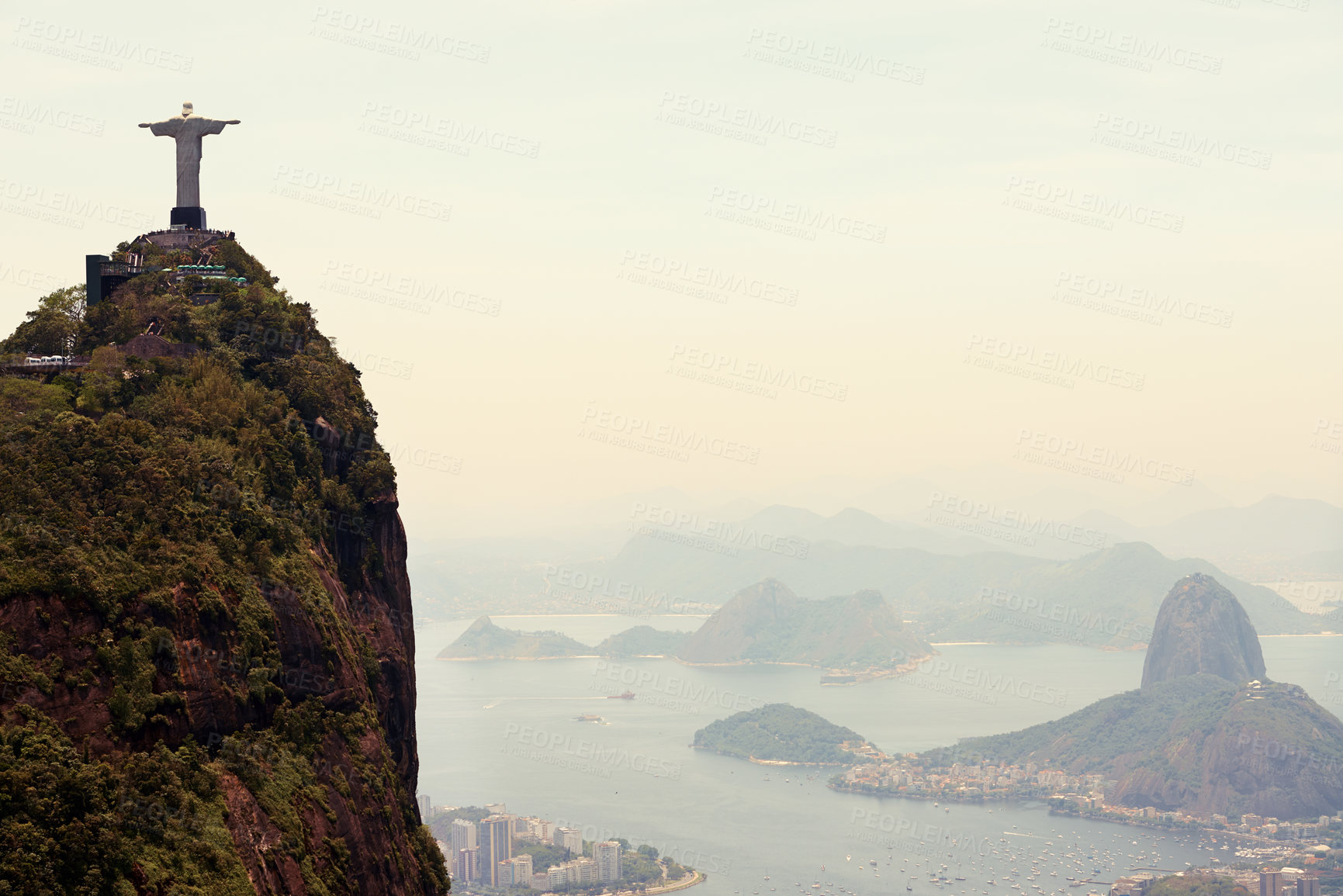 Buy stock photo Mountain, monument and aerial of Christ the Redeemer on hill for tourism, sightseeing and travel destination. Traveling mockup, Rio de Janeiro and statue, sculpture and city landmark by Brazil ocean