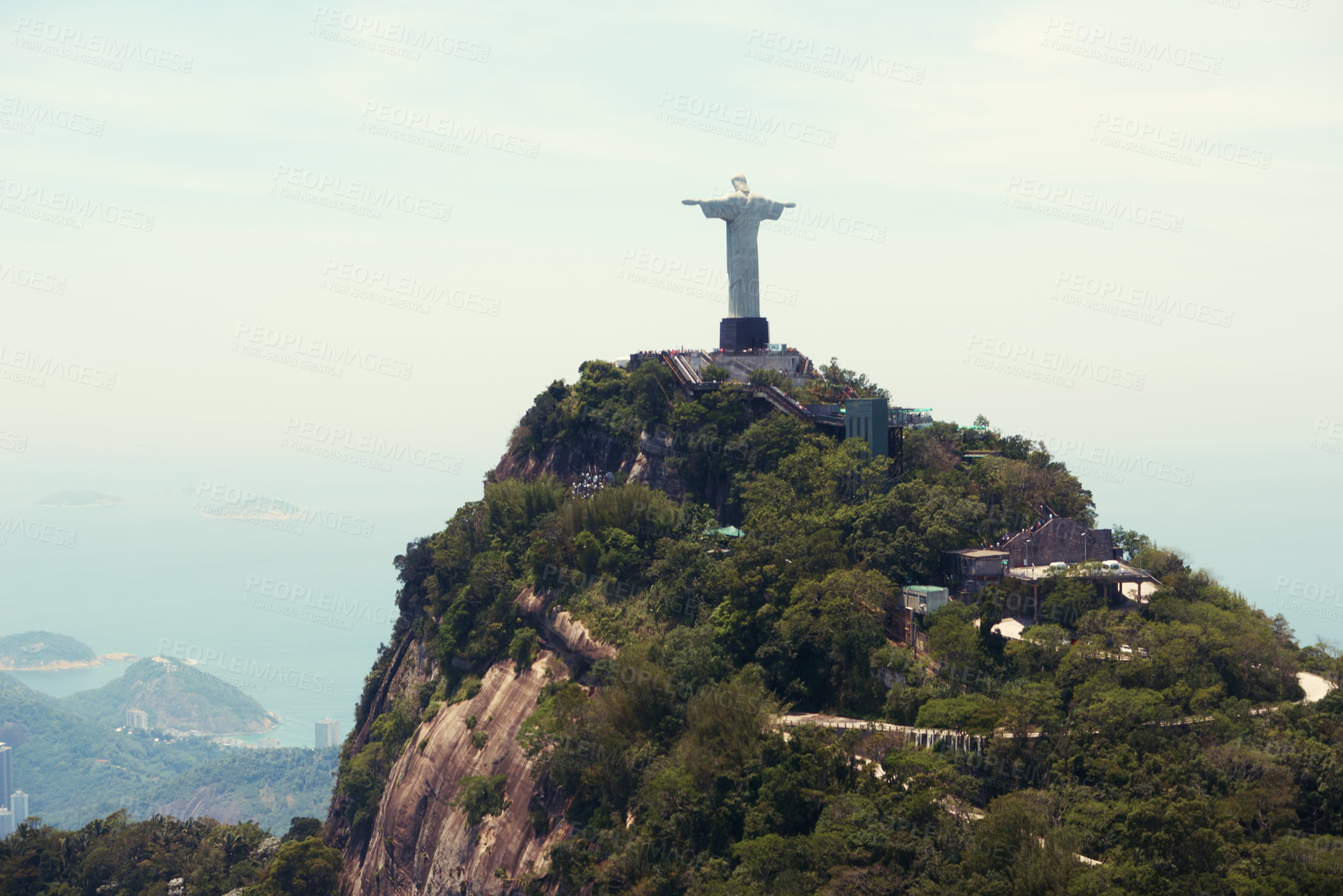 Buy stock photo Statue, monument and Christ the Redeemer in Brazil for tourism, sightseeing and global destination. Travel mockup, Rio de Janeiro and aerial view of landscape, sculpture and city landmark on mountain