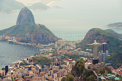 Buy stock photo Brazil, monument and Christ the Redeemer in city on hill for tourism, sightseeing and travel destination. Traveling, Rio de Janeiro and aerial view of statue, sculpture and landmark on mountain