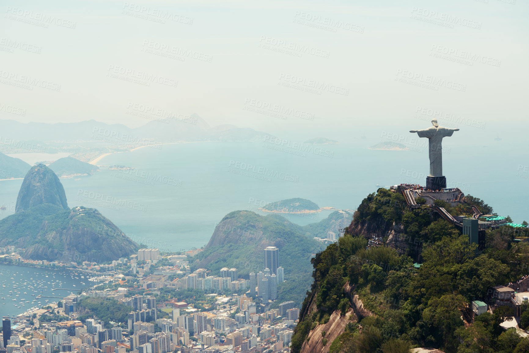 Buy stock photo Brazil, monument and aerial of Christ the Redeemer on hill for tourism, sightseeing and travel destination. Traveling, Rio de Janeiro and drone view of statue, sculpture and city landmark on mountain