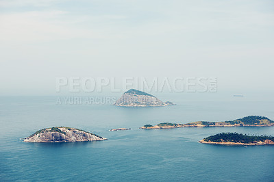 Buy stock photo Ocean, nature and aerial of island in sea for travel, holiday and vacation destination in summer. Natural background, seascape and islands in water for scenic view in environment, ecosystem and waves