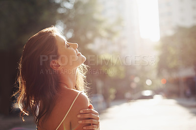 Buy stock photo Happy woman, relax and city street with sunshine for travel, freedom or breathing the fresh air in an urban town. Calm female person with smile for sunny day in road or sidewalk for summer vacation