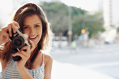 Buy stock photo Happy woman, portrait and photography with camera in city street for photo, memory or outdoor moment. Female person, tourist or photographer with smile or lens for picture or sightseeing in town