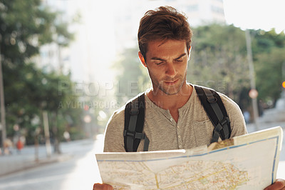 Buy stock photo Man, city and tourist with map for destination, location or tour guide in street or road. Male person or traveler looking at geographic paper on adventure route, journey trail or outdoor path in town