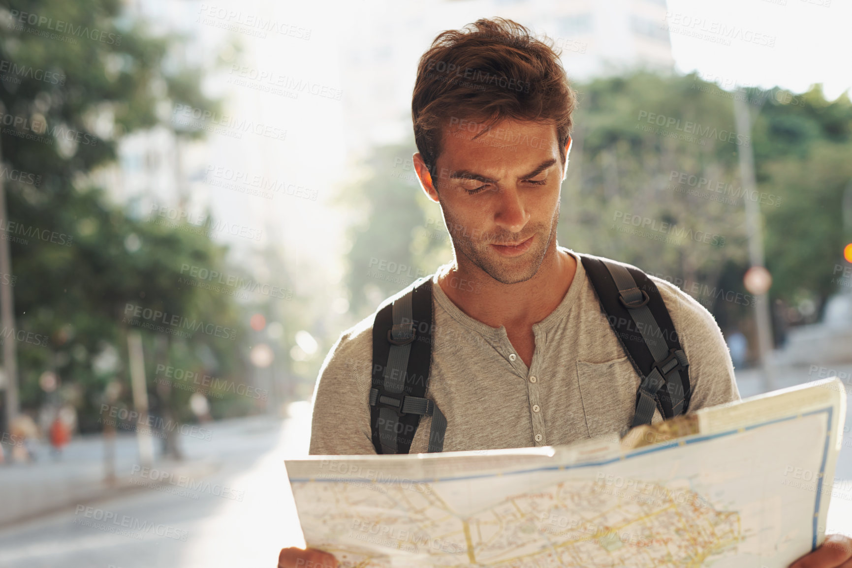 Buy stock photo Man, city and tourist with map for destination, location or tour guide in street or road. Male person or traveler looking at geographic paper on adventure route, journey trail or outdoor path in town
