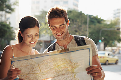 Buy stock photo Couple, travel or map for tourist destination with direction, tour route and happiness on holiday or vacation in Brazil. Face, man and woman with smile in city street for explore, tourism and journey