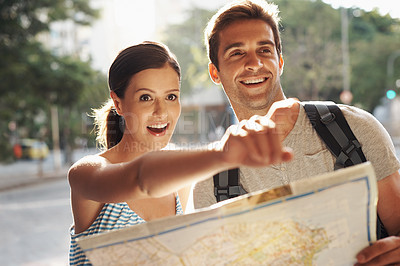 Buy stock photo Couple, pointing or map for tourist destination with direction, tour route and excited on holiday and vacation in Brazil. Face, man and woman with smile in city street for explore, tourism and travel