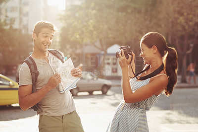 Buy stock photo Cropped shot of a young couple having fun while touring a foreign city