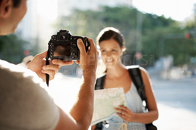 Buy stock photo Tourist, hand and photographer with camera in street for travel, sightseeing and memories on holiday or vacation. People, person and smile in city road for explore, tourism or journey in urban town