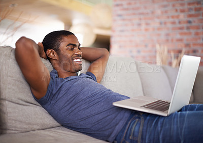 Buy stock photo Home, smile and black man with laptop, relax and connection with digital app or internet. African person, apartment or guy with computer or social media with online movie and entertainment in lounge