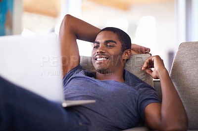 Buy stock photo Home, relax and black man with laptop, internet and connection with social media or entertainment. African person, apartment or guy with tech or computer with website information or reading a blog