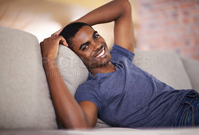 Buy stock photo Man, portrait and happiness on sofa with relax in living room of home with comfort, confidence or weekend. Student, african person and smile with face on couch in lounge for rest, day off or wellness