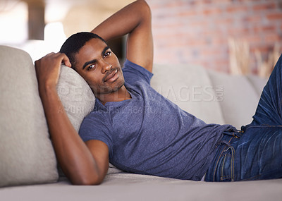 Buy stock photo Man, portrait and smile on couch with relax in living room of home with comfort, confidence or weekend. Student, african person and happiness with face on sofa in lounge for rest, day off or wellness