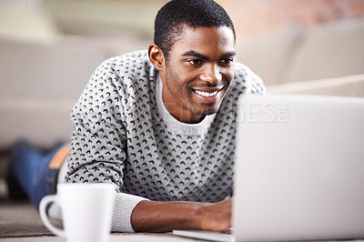 Buy stock photo Man, laptop and happy on sofa with relax for internet streaming, communication and online games in home. Student, african person and face with smile, email and technology in living room for research