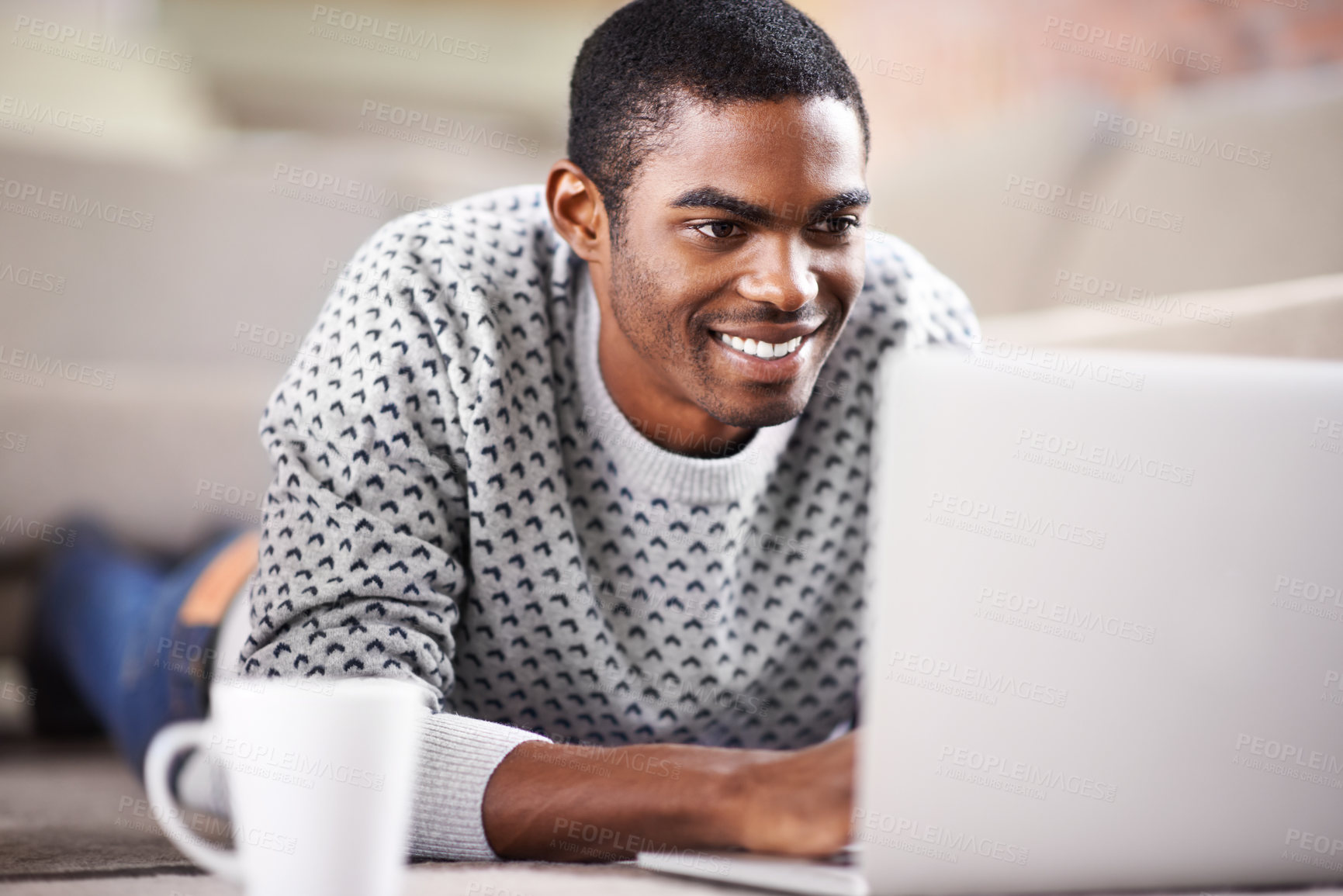 Buy stock photo Man, laptop and happy on sofa with relax for internet streaming, communication and online games in home. Student, african person and face with smile, email and technology in living room for research