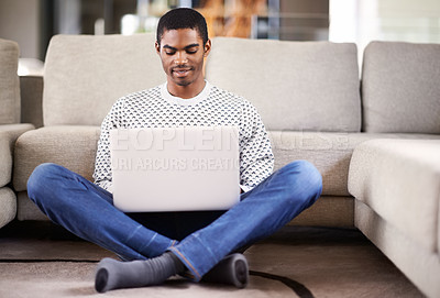 Buy stock photo Man, laptop and happy on floor with relax for internet streaming, communication and online games in home. Student, african person and face with smile, email and technology in living room for research