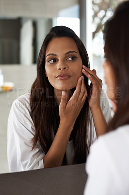 Buy stock photo Woman, check face in mirror and beauty with morning routine, acne and cosmetic care at home. Skincare, wellness and dermatology with skinlglow, reflection and grooming for hygiene in bathroom