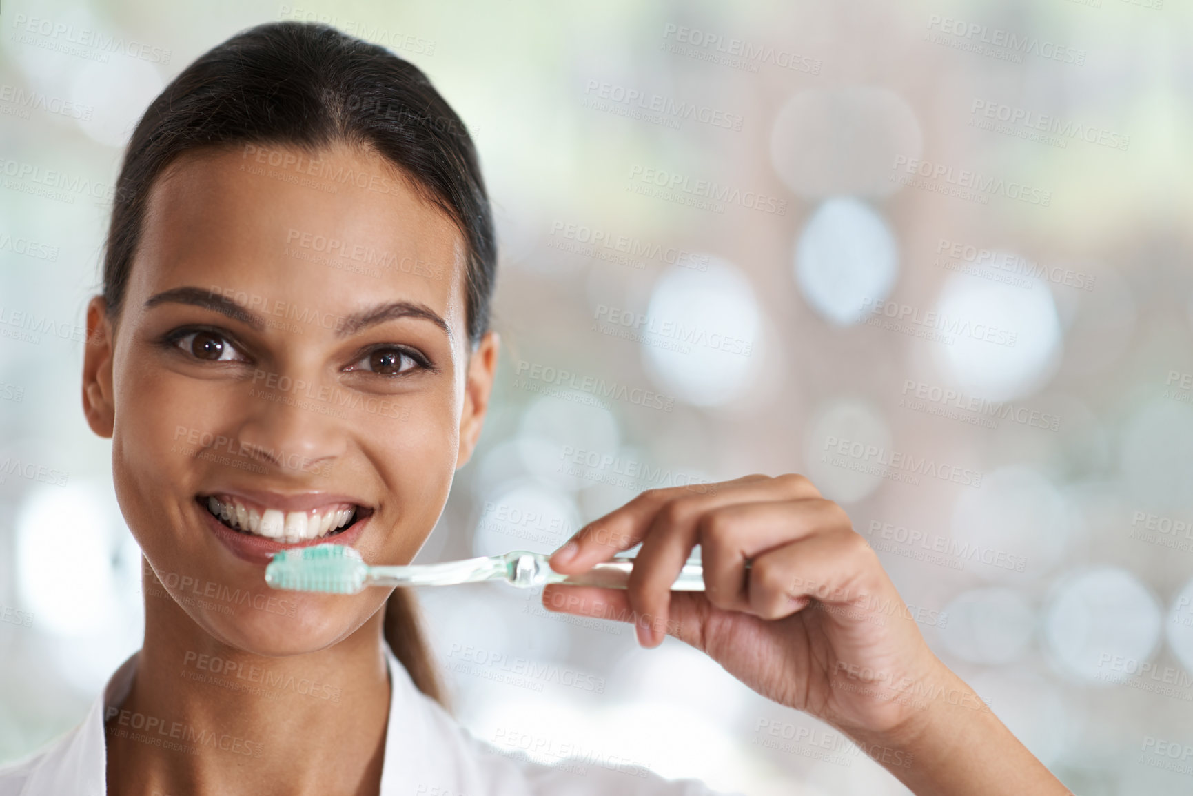 Buy stock photo Portrait of a smiling woman holding a toothbrush