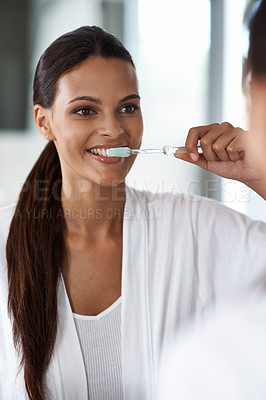 Buy stock photo Woman, brushing teeth and toothbrush for dental, mirror with smile in bathroom for morning routine. Oral hygiene, wellness and orthodontics with toothpaste for fresh breath, health and self care