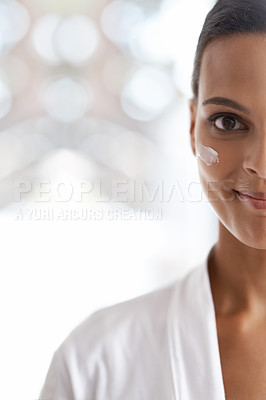 Buy stock photo Portrait, skincare and closeup of woman with lotion for dermatology, wellness or beauty in morning. Smile, moisturizer and face of person for cosmetics facial treatment and healthy skin in house.
