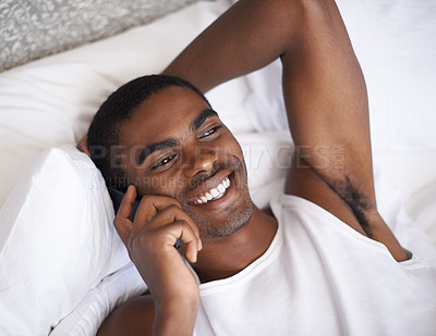 Buy stock photo Happy, black man and bed with phone for communication, conversation or networking in relax at home. Face of African male person with smile on mobile smartphone for discussion in bedroom at the house