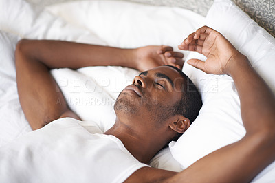 Buy stock photo Shot of a handsome young man sleeping at home