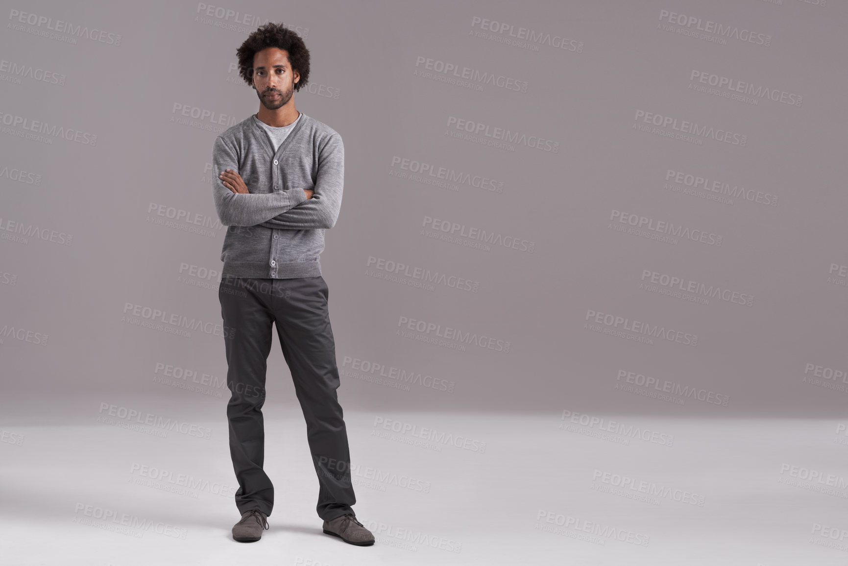 Buy stock photo Studio shot of a handsome young man isolated on gray