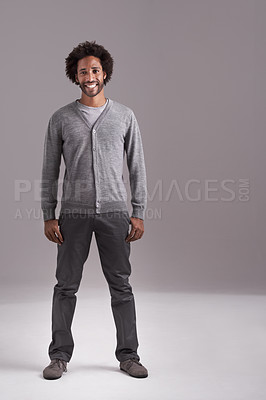 Buy stock photo Studio shot of a handsome young man isolated on gray