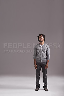 Buy stock photo Studio shot of a handsome young man isolated on gray