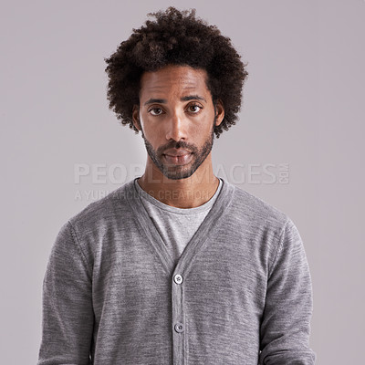 Buy stock photo Afro, studio and portrait of man with fashion for trendy, clothes and cool style on gray background. Jersey, black person and serious face with confidence for style, fashionable and relaxing
