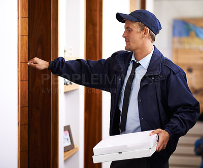 Buy stock photo Delivery, man and pizza at front door to home of customer, giving a box and easy service. Ecommerce, courier and person with fast food, takeaway and transport in supply chain of package to house