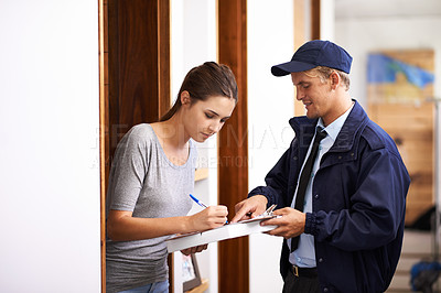 Buy stock photo Shot of a courier making a delivery to a smiling customer