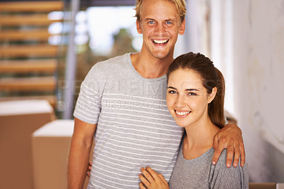 Buy stock photo Real estate, couple and portrait for property investment, new home and moving in hallway of house. Happiness, face of man and woman with hug for relocation, mortgage loan and cardboard boxes.