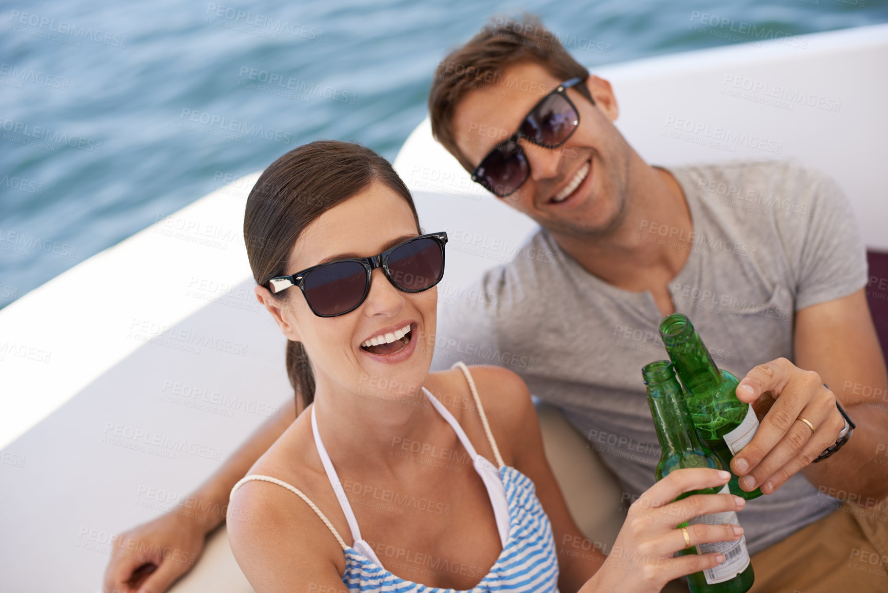 Buy stock photo Couple, portrait and toast on yacht, boat and cruise for honeymoon, holiday and vacation. Lovers, husband and wife together for alcohol with partnership, love and marriage by sea, ocean or beach