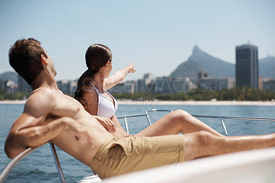 Buy stock photo Travel, relax and couple on boat in ocean for cruise, luxury sailing and transport on holiday, vacation and trip. Dating, love and man and woman on yacht for tropical journey, adventure and bonding