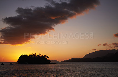 Buy stock photo Tropical, island and ocean with sunset on horizon, travel and relax morning in nature in summer. Holiday destination, calm or boats on sea for vacation, night or view of mountain in beach landscape