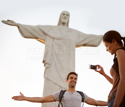 Buy stock photo Tourist, happy and photograph with monument for sightseeing, freedom and christ the redeemer statue in Rio de Janeiro with girlfriend. Couple, explore and holiday for adventure or tour with cellphone