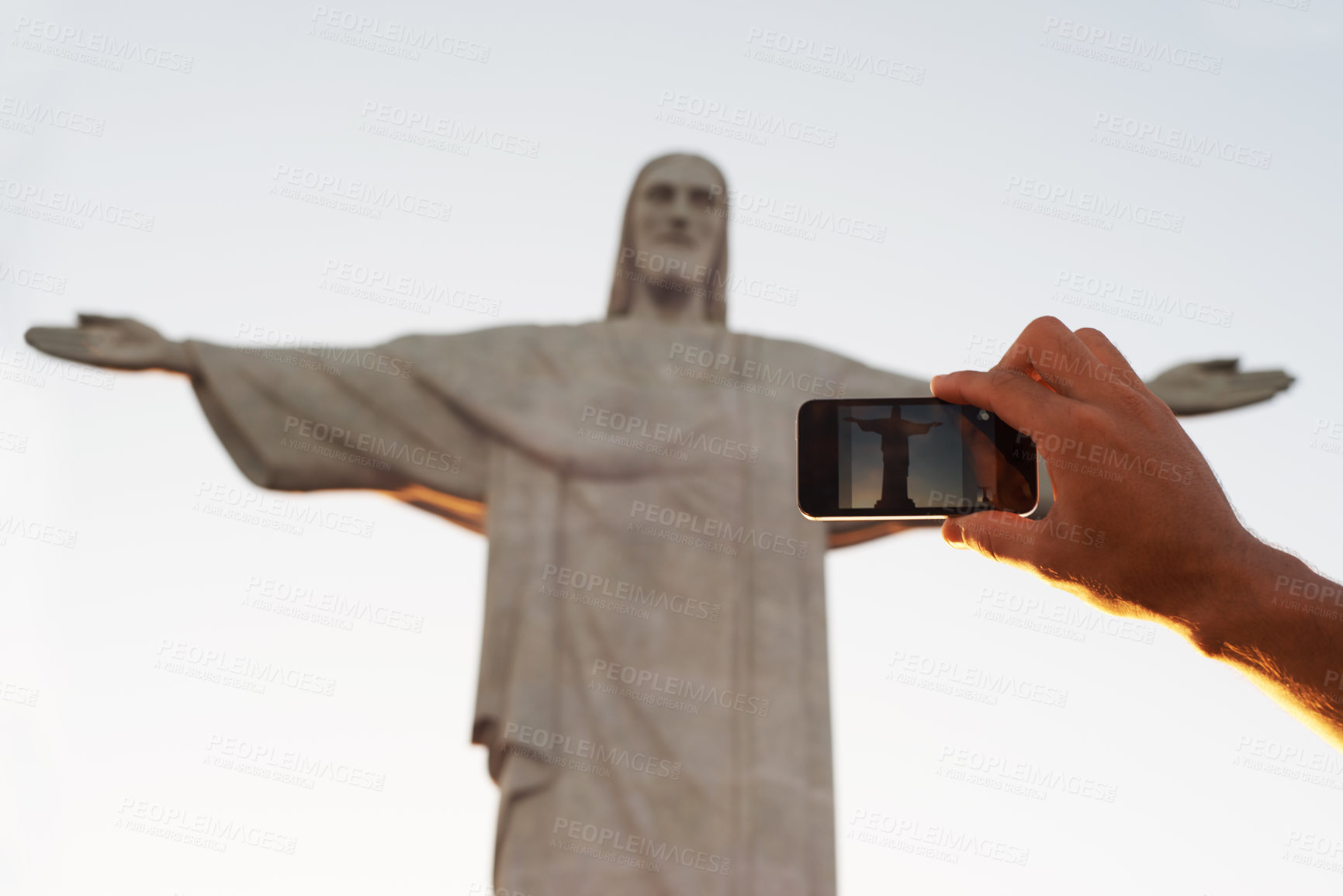 Buy stock photo Jesus christ, statue or hand of tourist with photo of sculpture for travel or christian faith for art. Person, history monument or peace for tourism, God or religion symbol in Rio de Janeiro, Brazil 