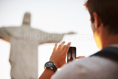 Buy stock photo Jesus christ, man or tourist with photo of statue or sculpture for travel or christian faith for art. Person, history monument or picture for tourism, God or religion symbol in Rio de Janeiro, Brazil